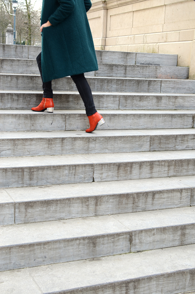 Green coat, orange shoes via noglitternoglory.com