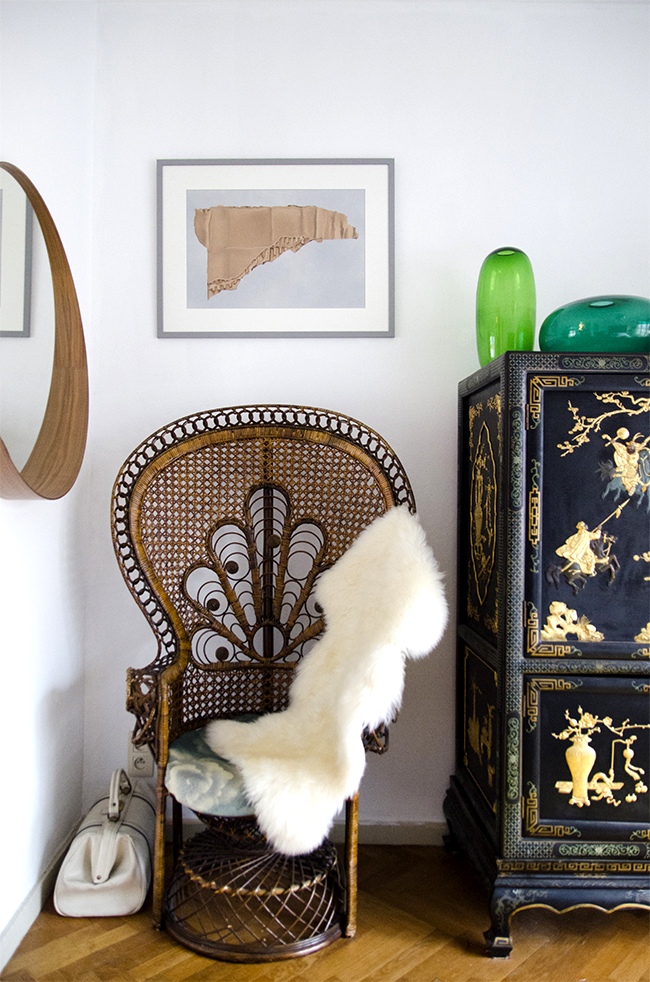 Nathalie & Michiel's arty eclectic apartment // peacock chair & chinese credenza