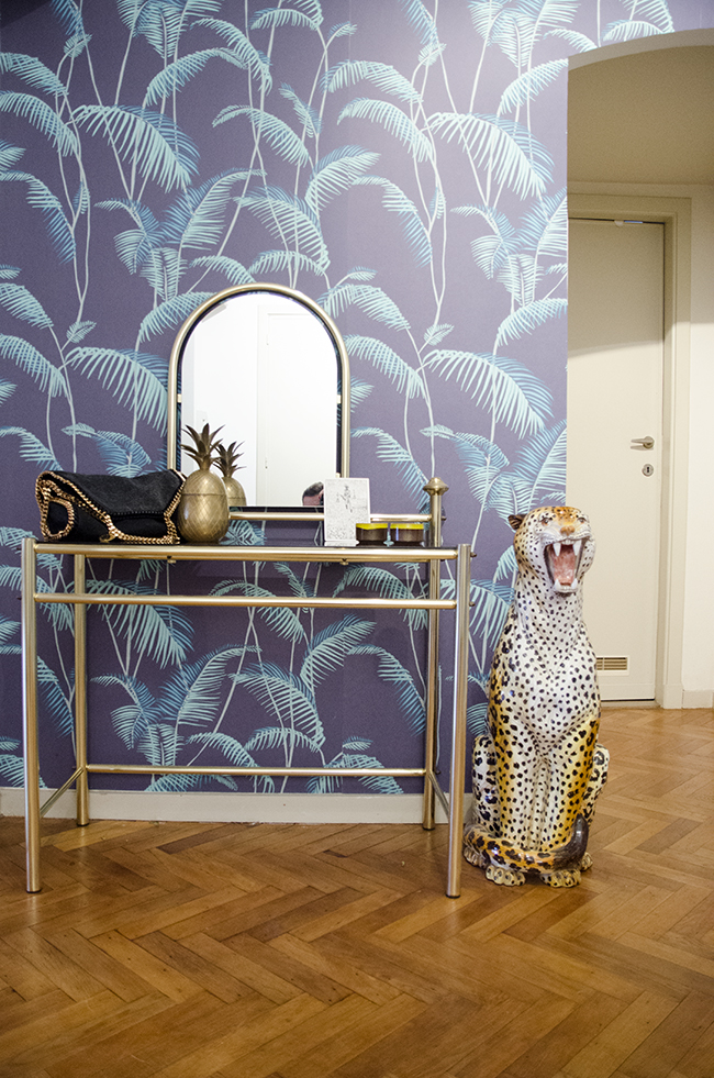 Nathalie and Michiel's Arty & Eclectic Apartment // Palm Wallpaper print, brass vanity & panther statue